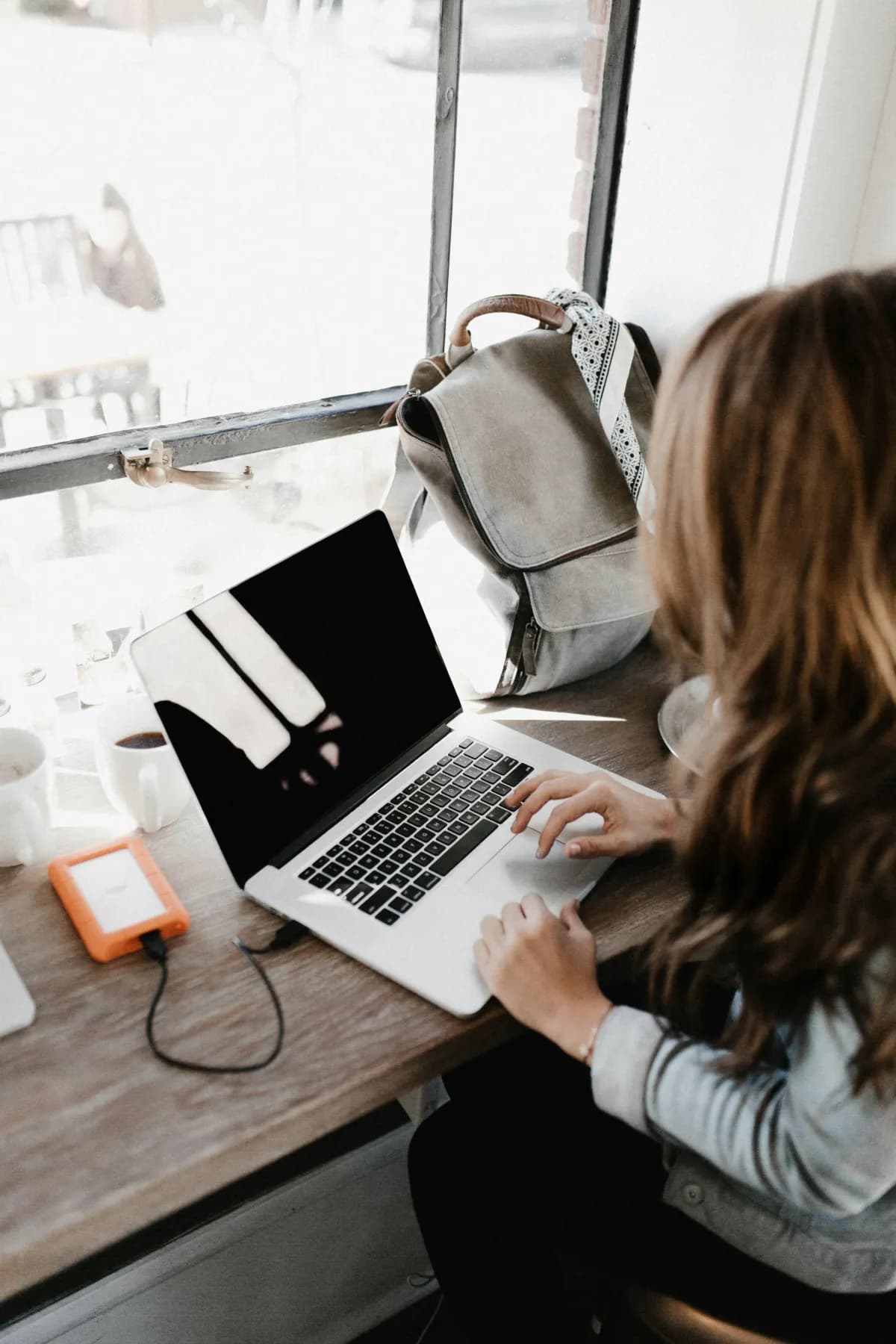 A service-business owner reviewing their Google Ads performance on a laptop